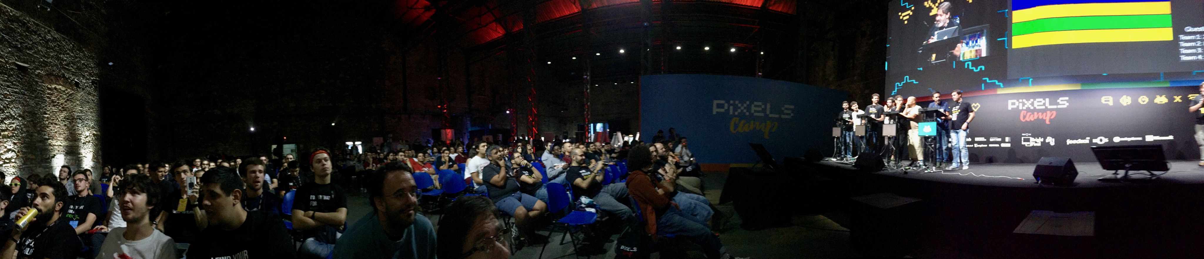 a panorama of the Pixels Camp main stage, showing the audience and contestants on stage