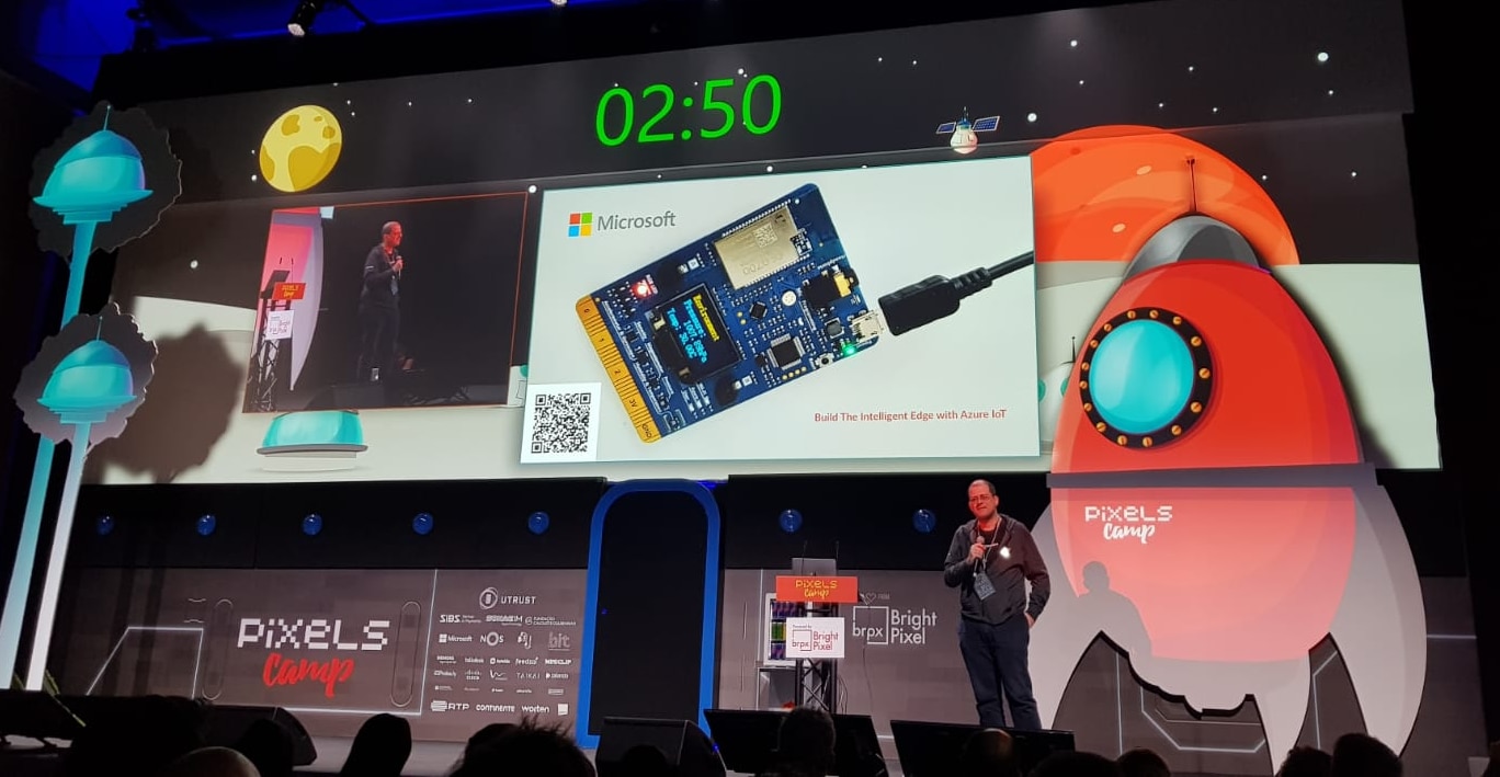 Me on stage, with a picture of the MxChip front and center