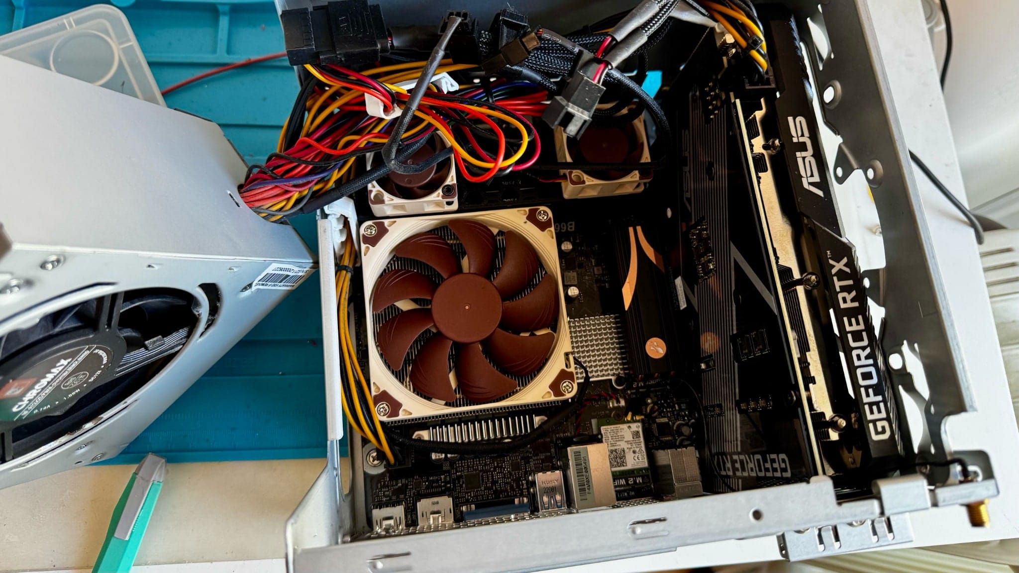 Yes, of course I modded the PSU fan to bring in extra cooling