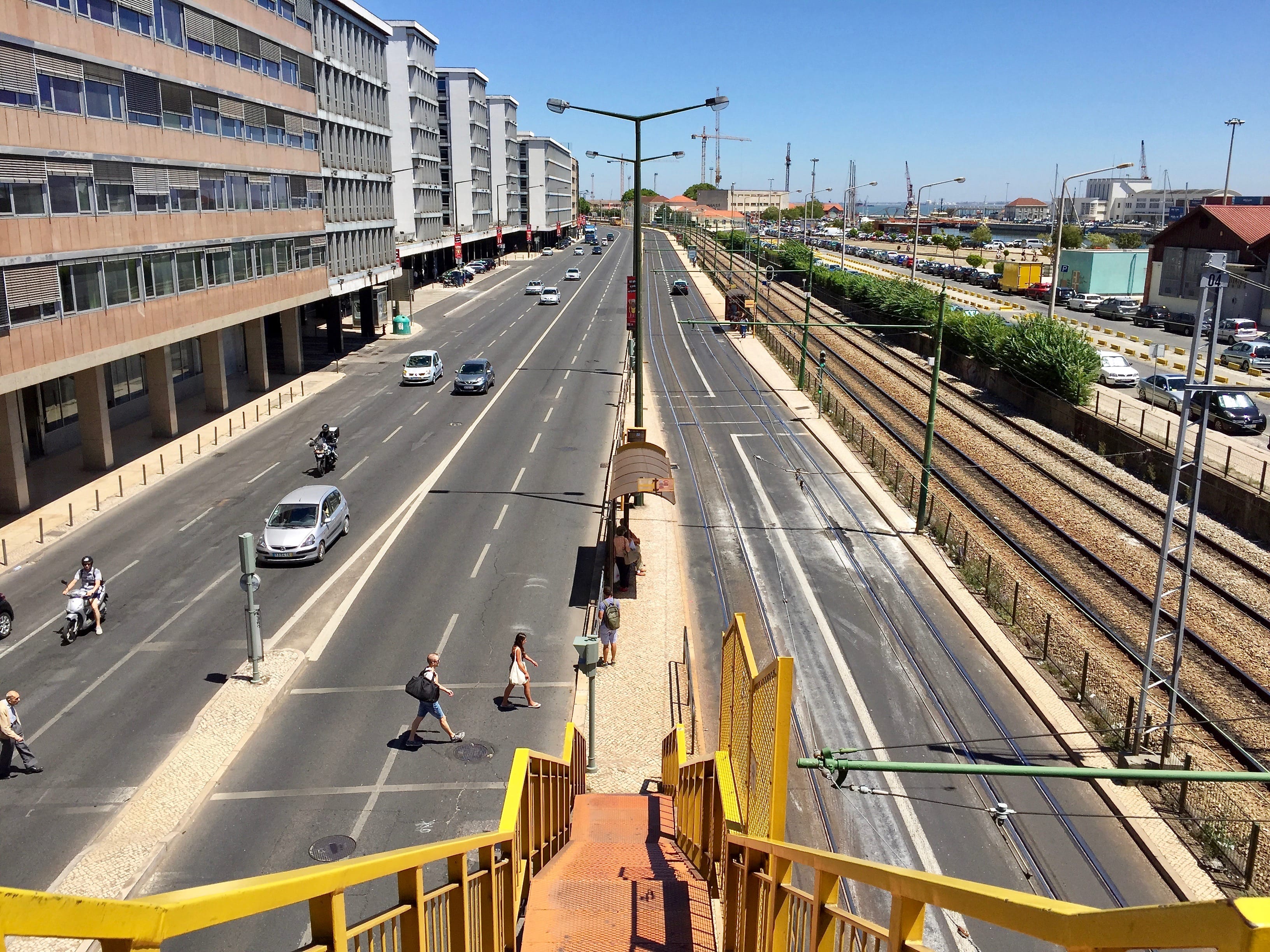 looking down stairs onto multiple empty lanes in a riverside avenue