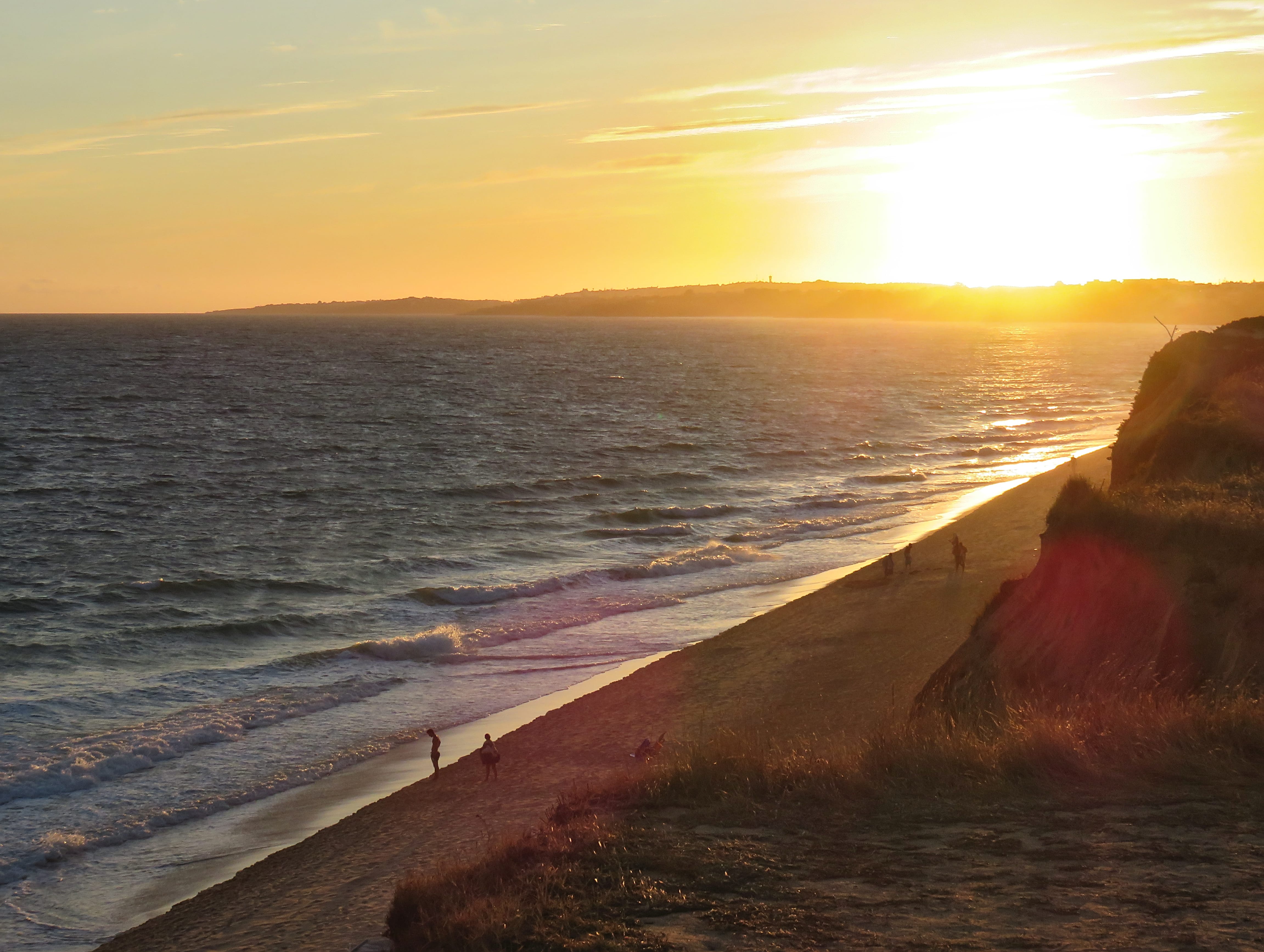 looking down towards the beach as the sun falls