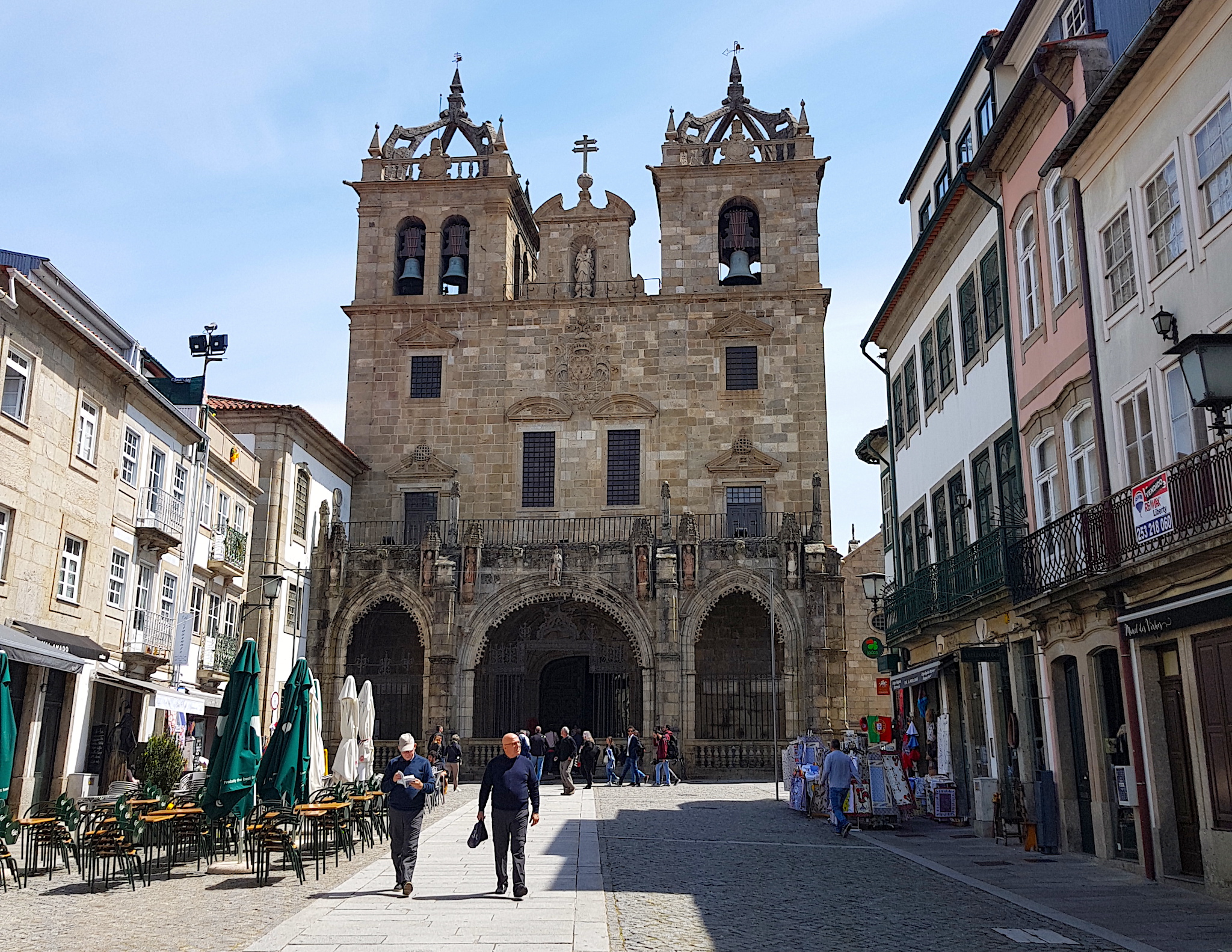 a granite plaza in front of an old church