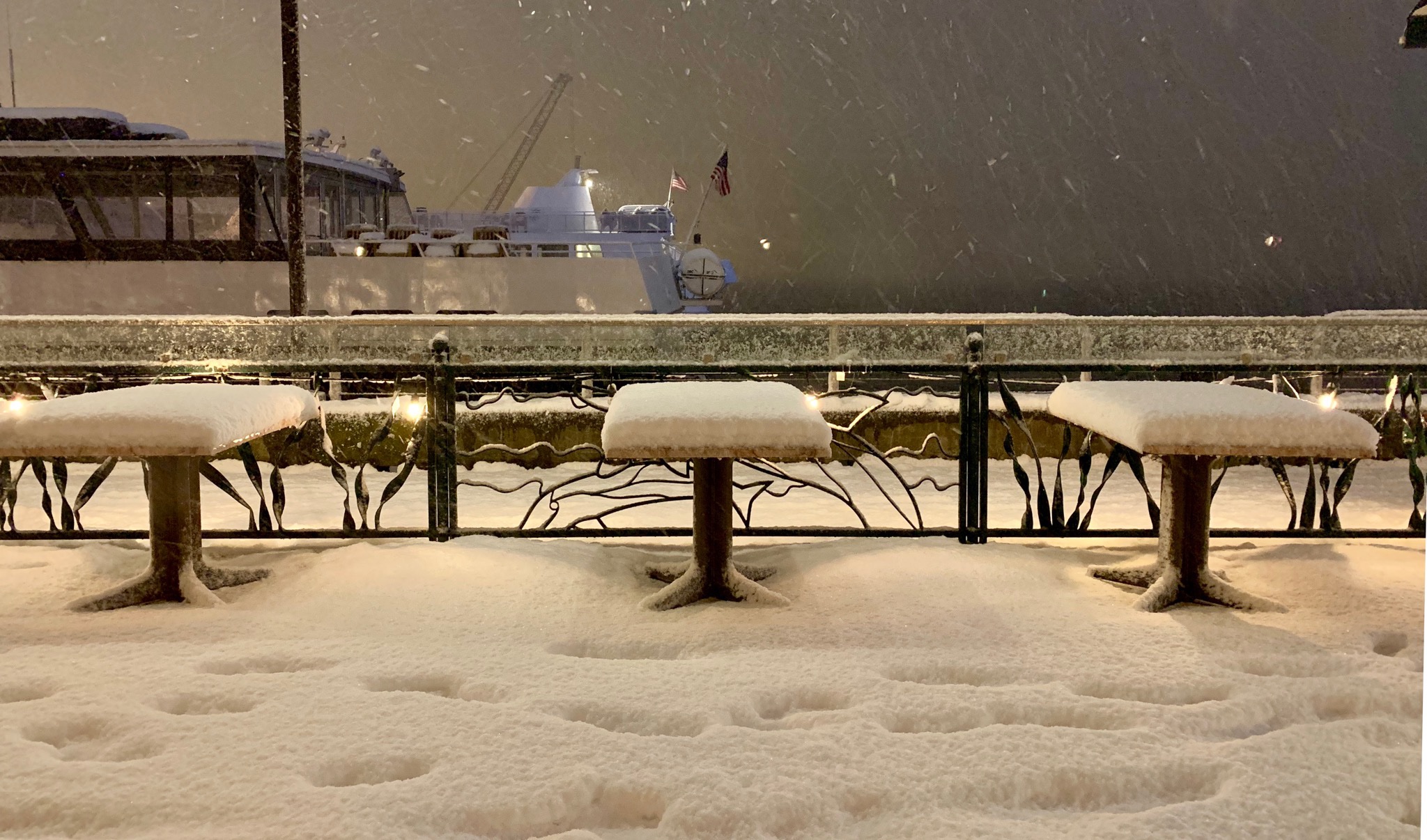 Snow-laden tables near Pier 56